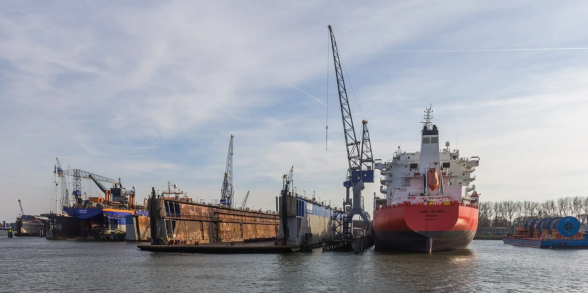 Vessel in a graving dock with cranes alongside