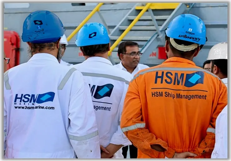 Ship's crew gathered for an on-board briefing